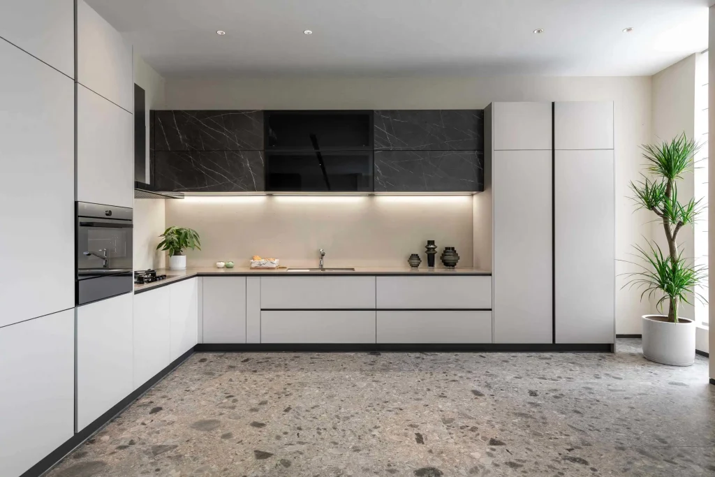 A busy hotel kitchen with durable laminate cabinets next to a standard apartment kitchen with clean melamine cabinets.
